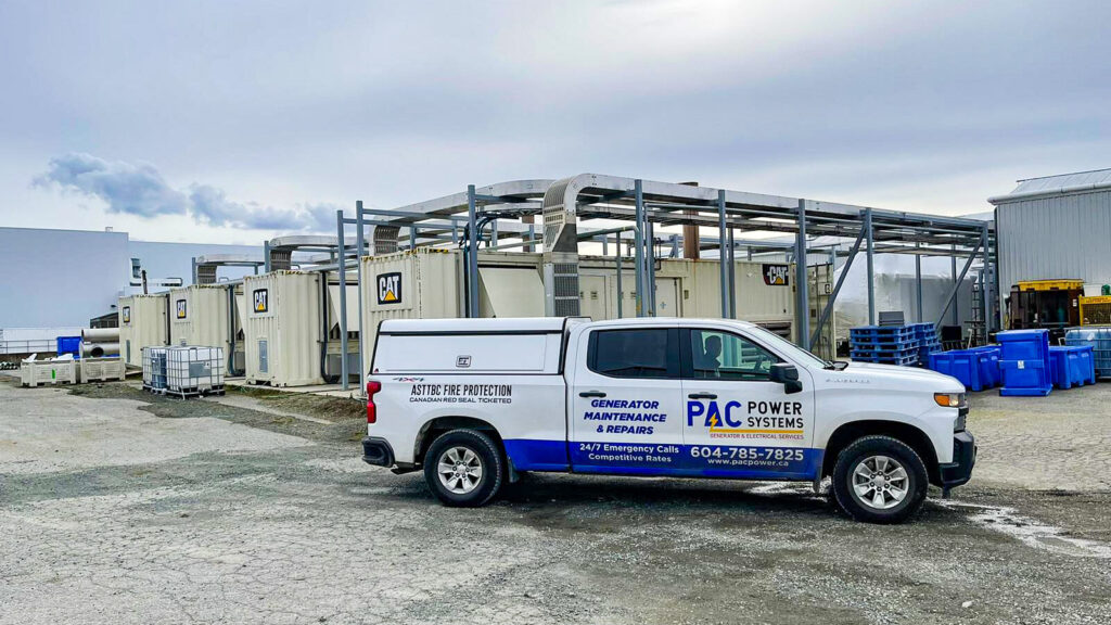 PAC Power Systems service truck parked at an industrial site with generators in the background